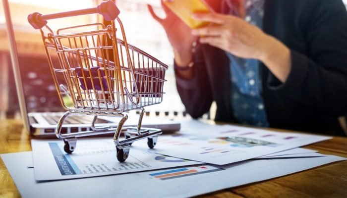 cropped-image-woman-inputting-card-information-key-phone-laptop-while-shopping-online.jpg