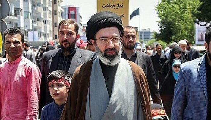 Mojtaba_Khamenei_and_his_children_in_Quds_Day_1397.jpg