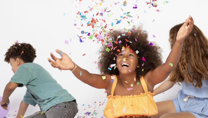 medium-shot-kids-playing-with-confetti.jpg